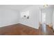 Open living room with hardwood floors and a view into the kitchen at 5589 Trace Views Dr, Norcross, GA 30071