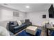 Finished basement area with comfortable seating and a mounted television at 6547 Demere Dr, Morrow, GA 30260
