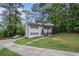 Traditional two-story home showing the side yard and the driveway at 6547 Demere Dr, Morrow, GA 30260