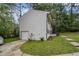 Charming home with a one car garage, manicured lawn and sidewalk leading to the front porch at 6547 Demere Dr, Morrow, GA 30260
