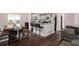 Open-concept kitchen and dining area with modern appliances and bar stool seating at 6547 Demere Dr, Morrow, GA 30260