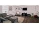 Comfortable living room with a large sectional sofa and a mounted flat-screen television at 6547 Demere Dr, Morrow, GA 30260