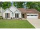 Charming single-story home featuring a well-manicured lawn and a two-car garage at 1095 Athena Ct, Acworth, GA 30101