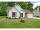 Charming one-story home with white siding, attached garage, and well-maintained lawn at 1095 Athena Ct, Acworth, GA 30101