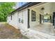 Back exterior featuring a covered patio and brick foundation at 1477 Olive Sw St, Atlanta, GA 30310