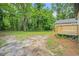 Expansive backyard with a wooden deck and lots of green foliage at 1477 Olive Sw St, Atlanta, GA 30310