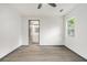 Bedroom showcasing wood-look flooring, a ceiling fan, and a view into the bathroom at 1477 Olive Sw St, Atlanta, GA 30310
