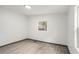 Bright bedroom featuring vinyl floors, white walls, natural light and a window at 1477 Olive Sw St, Atlanta, GA 30310