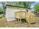 Rear exterior of house featuring a small wood deck with stairs to the yard at 1477 Olive Sw St, Atlanta, GA 30310