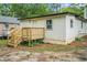 Exterior featuring a cozy deck with wood stairs and a white siding at 1477 Olive Sw St, Atlanta, GA 30310