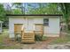 Charming exterior featuring wood stairs leading to the home's entrance and white siding at 1477 Olive Sw St, Atlanta, GA 30310