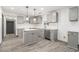 A kitchen with gray cabinets, an island, and stainless steel appliances at 1477 Olive Sw St, Atlanta, GA 30310