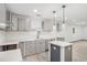 Kitchen showcasing gray cabinets, white subway tile, and an island at 1477 Olive Sw St, Atlanta, GA 30310