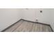 Clean laundry area showcases modern gray vinyl flooring and white walls at 1477 Olive Sw St, Atlanta, GA 30310