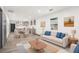 Bright, open-concept living room with modern decor and hardwood flooring at 1477 Olive Sw St, Atlanta, GA 30310