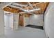 Unfinished basement with exposed ductwork, utilities, and a concrete floor at 2539 Lakeside Dr, Villa Rica, GA 30180