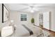 Bright bedroom with ceiling fan, wood floor and view to the wooded backyard at 2539 Lakeside Dr, Villa Rica, GA 30180