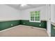 Bedroom featuring a window, neutral carpet, painted walls, and a white ceiling at 2539 Lakeside Dr, Villa Rica, GA 30180