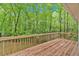 A wooden deck overlooking a beautiful wooded backyard view at 2539 Lakeside Dr, Villa Rica, GA 30180