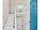 Bright foyer with white staircase and railing leading to the upper level at 2539 Lakeside Dr, Villa Rica, GA 30180