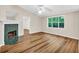 Living room features wood flooring, white trim and a view to the wooded backyard at 2539 Lakeside Dr, Villa Rica, GA 30180