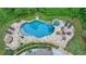 Aerial view of a home with a beautiful in-ground pool and outdoor seating area at 5475 Trowbridge Dr, Dunwoody, GA 30338
