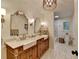 Beautiful bathroom with a dual sink vanity, farmhouse style cabinets, and a separate toilet and shower area at 5475 Trowbridge Dr, Dunwoody, GA 30338
