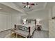 Spacious bedroom with a decorative bed frame, neutral tones, and ample closet space for storage and organization at 5475 Trowbridge Dr, Dunwoody, GA 30338