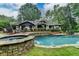 Beautiful backyard view of home with pool, spa, and outdoor seating area at 5475 Trowbridge Dr, Dunwoody, GA 30338