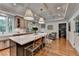 Open concept kitchen with large island, pendant lighting, and stainless steel appliances at 5475 Trowbridge Dr, Dunwoody, GA 30338