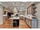 Spacious kitchen with island, custom cabinetry, modern appliances, and hardwood flooring at 5475 Trowbridge Dr, Dunwoody, GA 30338
