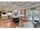 Bright kitchen features large island with seating, stainless appliances, and backyard access at 5475 Trowbridge Dr, Dunwoody, GA 30338