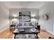 Cozy living room featuring hardwood floors, neutral tones, and elegant decor at 5475 Trowbridge Dr, Dunwoody, GA 30338