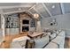 Inviting living room with brick fireplace, built-in bookcases, hardwood floors, and comfortable seating at 5475 Trowbridge Dr, Dunwoody, GA 30338