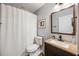 Modern bathroom features a combination shower and tub, a sleek vanity, and neutral color scheme at 6000 Hampton Bluff Way, Roswell, GA 30075
