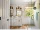The bathroom features a double vanity, shower with glass door, and wooden accents at 6000 Hampton Bluff Way, Roswell, GA 30075