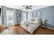 Bedroom boasts hardwood floors, natural light, and a calming ambiance, perfect for relaxation and rest at 6000 Hampton Bluff Way, Roswell, GA 30075