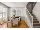 Formal dining area boasts wood floors, decorative trim, and a modern chandelier at 6000 Hampton Bluff Way, Roswell, GA 30075