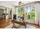 Sun-filled home office with hardwood floors, abundant natural light, desk, and views of the outdoors at 6000 Hampton Bluff Way, Roswell, GA 30075