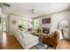 Inviting living room features a cozy fireplace, hardwood floors, and neutral decor with lots of natural light at 6000 Hampton Bluff Way, Roswell, GA 30075