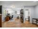A bright basement office space featuring hardwood floors, a desk, shelving, and a convenient adjacent bathroom at 6000 Hampton Bluff Way, Roswell, GA 30075
