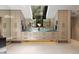 Bright bathroom featuring double sinks, modern cabinetry, and a large window offering ample natural light and views at 6525 Old Riverside Nw Dr, Sandy Springs, GA 30328