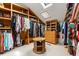 Spacious walk-in closet with built-in shelving and drawers, maximizing storage and organization with a skylight at 6525 Old Riverside Nw Dr, Sandy Springs, GA 30328