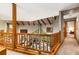 Open hallway offering a view of the living room below, enhanced by natural light and wood accents at 6525 Old Riverside Nw Dr, Sandy Springs, GA 30328