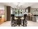 Modern kitchen with stainless steel appliances, island seating, and contemporary light fixture at 6525 Old Riverside Nw Dr, Sandy Springs, GA 30328