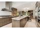 Open kitchen layout with a large center island, stainless steel appliances, and modern countertops at 6525 Old Riverside Nw Dr, Sandy Springs, GA 30328