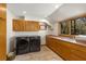 Laundry room with cabinets, sink and counter space, and a large window for natural light at 6525 Old Riverside Nw Dr, Sandy Springs, GA 30328