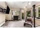 Bright living room with fireplace, high ceilings, modern decor and large windows offering scenic wooded views at 6525 Old Riverside Nw Dr, Sandy Springs, GA 30328
