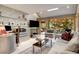 Comfortable living area with a large window, neutral decor, and a modern workspace setup at 6525 Old Riverside Nw Dr, Sandy Springs, GA 30328