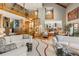 Bright and airy living room boasting soaring ceilings, a spiral staircase, and an open layout that is perfect for entertaining at 6525 Old Riverside Nw Dr, Sandy Springs, GA 30328